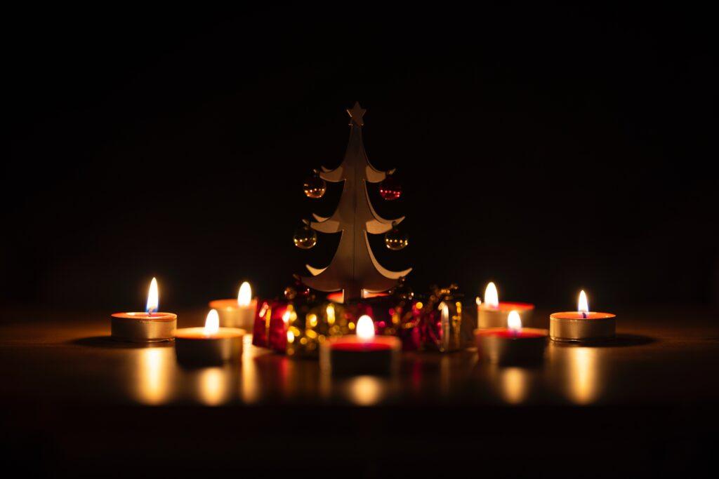 Blue Light Safety Christmas fire safety image of a wooden christmas tree and candles